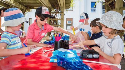 Children at MoAD doing craft activities outside
