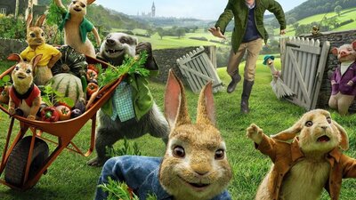 Animated still from Peter Rabbit showing a group of rabbits running away from a man