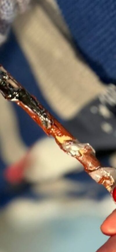 Proud wizard holding his newly made wand