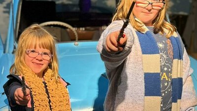 Two young witches holding new made wands