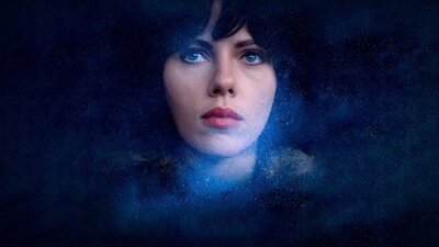 Under the Skin (2013) Womans face gazes through stars in the sky