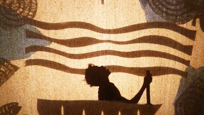 Playing with Light Shadow puppetry workshops Boy in canoe shadow puppets
