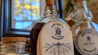 Potions bottles for making cocktails. This one is labelled "Extract of Smilax Root".