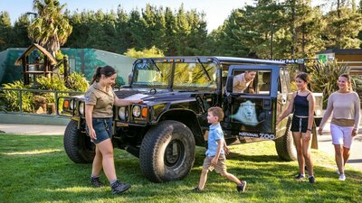 The Hummer - one of the vehicles you can choose for our Wild Night ZooVenture Tours Family and zoo guide with a Hummer, a vehicle used for night tours within the national zoo