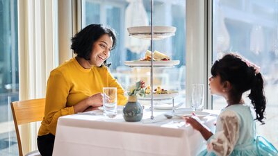 Mother and young daughter enjoying high tea at Parliament House