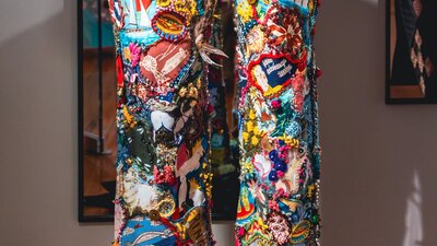 Anyone Seen Those Old Jeans by Wendy Saclier. Detailed shot of jeans, embroidered with bright motifs