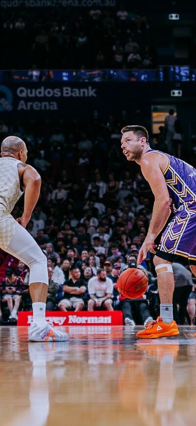 Matthew Dellavedova with ball in Kings game against Taipans