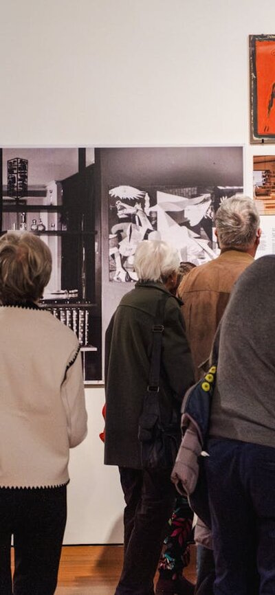 People exploring the Taglietti Exhibition