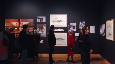 People exploring the Taglietti exhibition