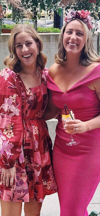 Two women dressed up for the races.