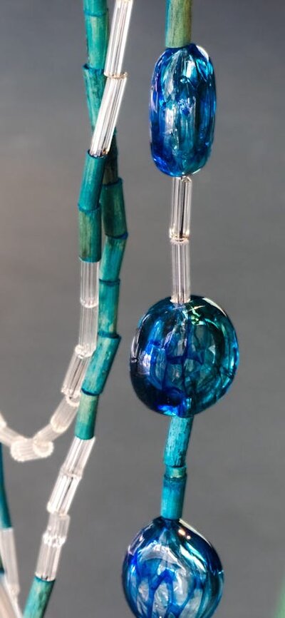 Detail of a reed necklace made with glass by Maree Clarke