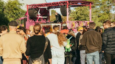 People dancing in the sun to a DJ on the Soul Defender