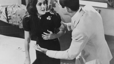 Suddenly, Last Summer (1959) black and white still of woman looking distressed and man speaking to her