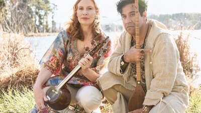 Anna McDonald, holding an Iranian kamancheh (spike fiddle) and Malek Mohammadi Nejad holding a setar