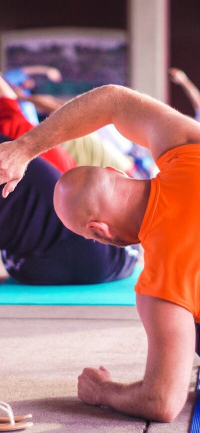 people doing yoga in bright clothes