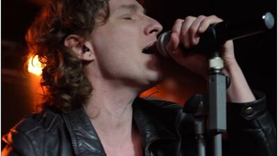 Close up of Bon Jovi impersonator performing