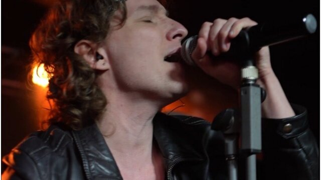 Bon Jovi: The Legacy Close up of Bon Jovi impersonator performing