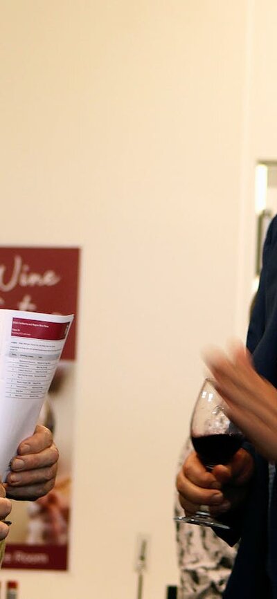 Nick O'Leary talking to a wine taster