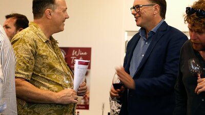 Nick O'Leary talking to a wine taster