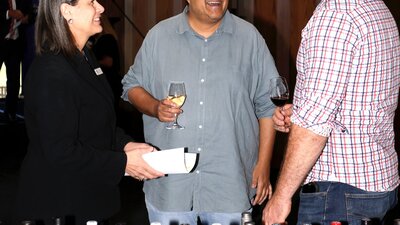 people talking and tasting wine