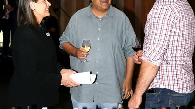 people talking and tasting wine