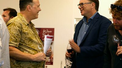 Nick O'Leary talking to a wine taster