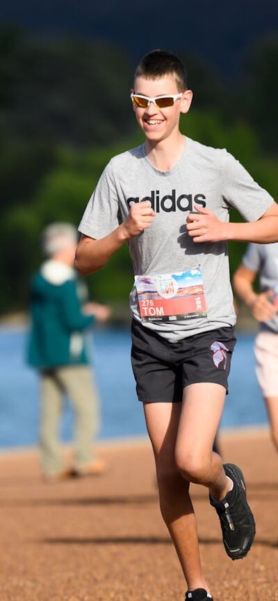 People running and smiling towards the camera