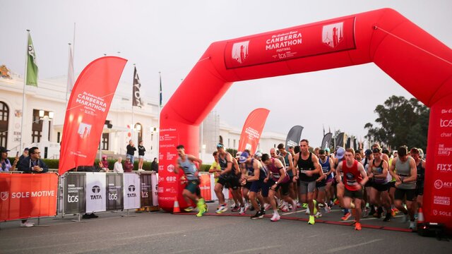 Participants crossing the start line