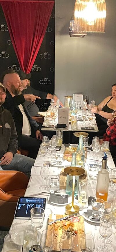 Crowd of people at tables ready to drink