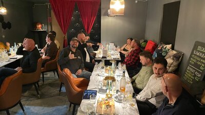 Crowd of people at tables ready to drink