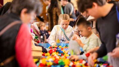 4 children rummaging through lego at the Great Lego Sale, 2025