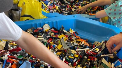 Large shells of lego with hands going in Large shells of lego with hands going in