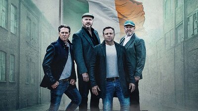High kings standing in front of irish flag