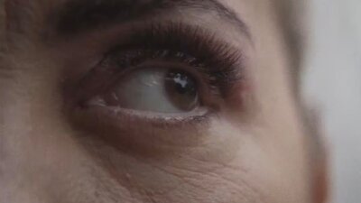 Image: Amala Groom The Lodge 2025, production still, courtesy of the artist. A close up image of a woman's eye and eyebrow