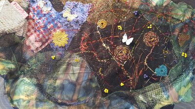Textile artwork with butterflies and flowers