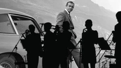 Sean Connery with silhouette of big band in front of him