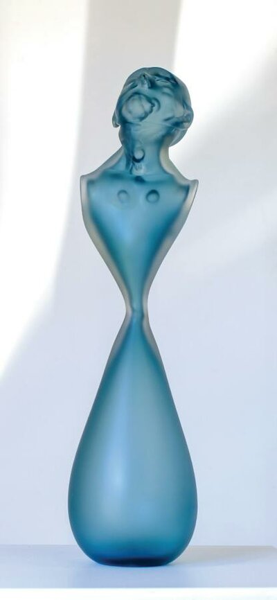 Glass bust looking up in blue