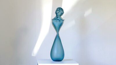 Glass bust looking up in blue