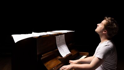 Jon at the piano composing