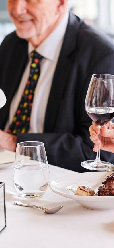Woman and man enjoying dinner at Parliament House
