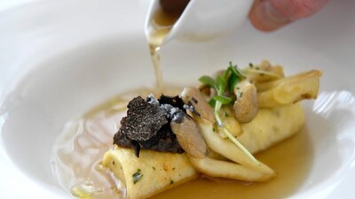 Plated dish featuring truffle and mushroom