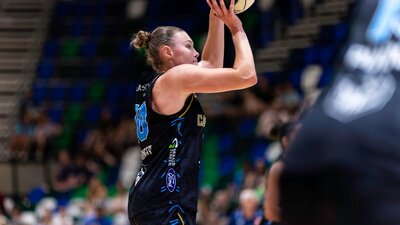 UC Capitals player shooting the basketball.