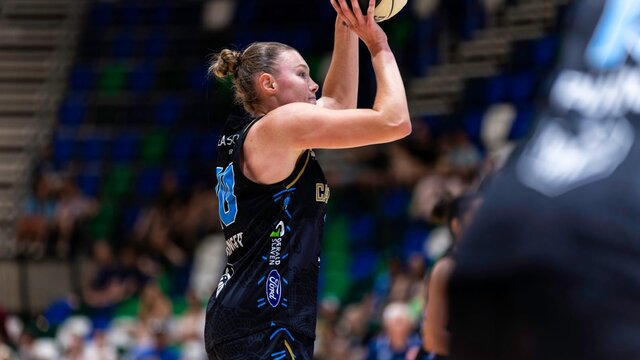 UC Capitals player shooting the basketball.