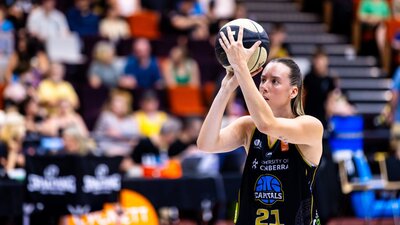 UC Capitals player shooting the basketball.
