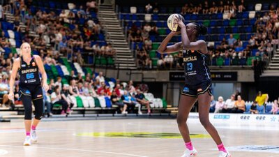 UC Capitals player shooting the basketball while a defender closes in.