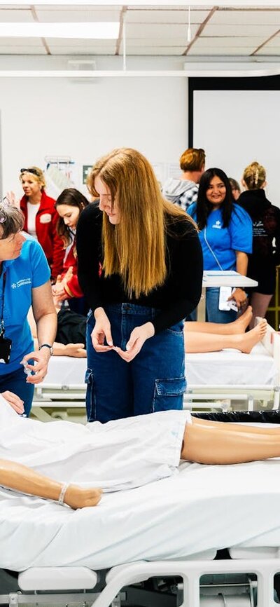 Prospective students exploring the advanced facilities available to them in the Faculty of Health