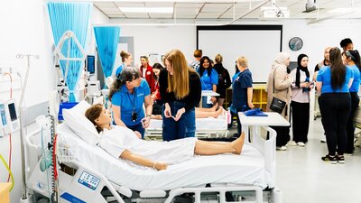 Prospective students exploring the advanced facilities available to them in the Faculty of Health