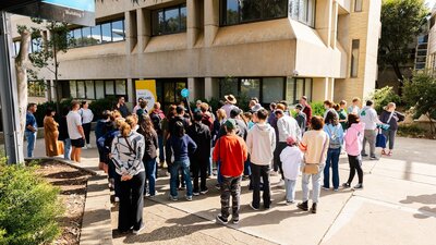 A gathering of the public attending a campus tour