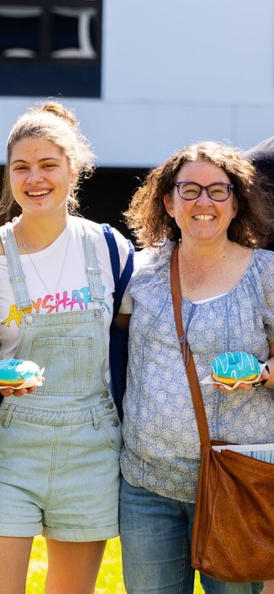 Happy family with blue donuts