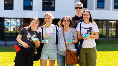 Happy family with blue donuts